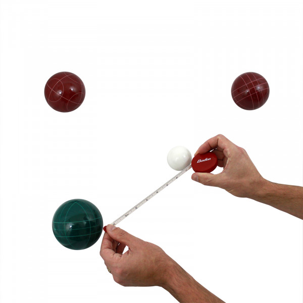 Measuring the distance between bocce balls with the included measuring tape.