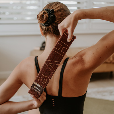 Image of a model using the heavy BAHE Flowloop to perform a shoulder exercise.