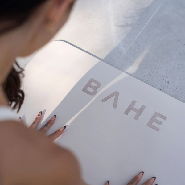 An over-shoulder lifestyle image of a model using the BAHE Studio Stance Mat
