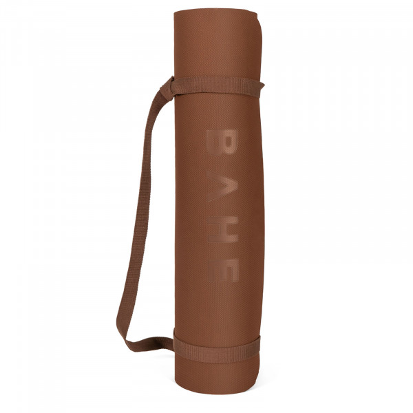 A white background product image of the BAHE Soft Touch Reversible XL 6mm Mat rolled up with carry strap in the Cinnamon colour variation.
