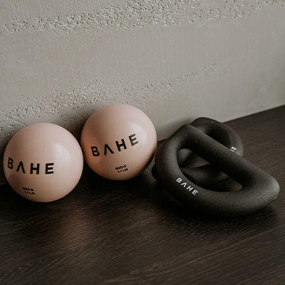 Photograph of the BAHE Toning Balls with the BAHE Halo Weight pairs besides them