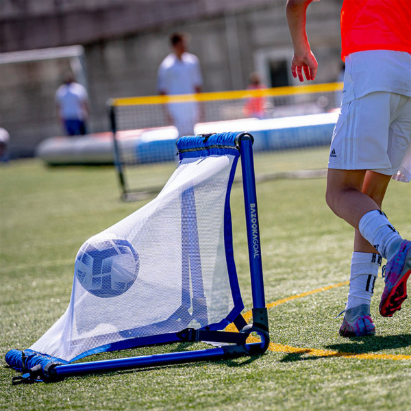 Angle view of the BazookaGoal Football Goal (Aluminium), Royal Blue / White, ball inside net during play