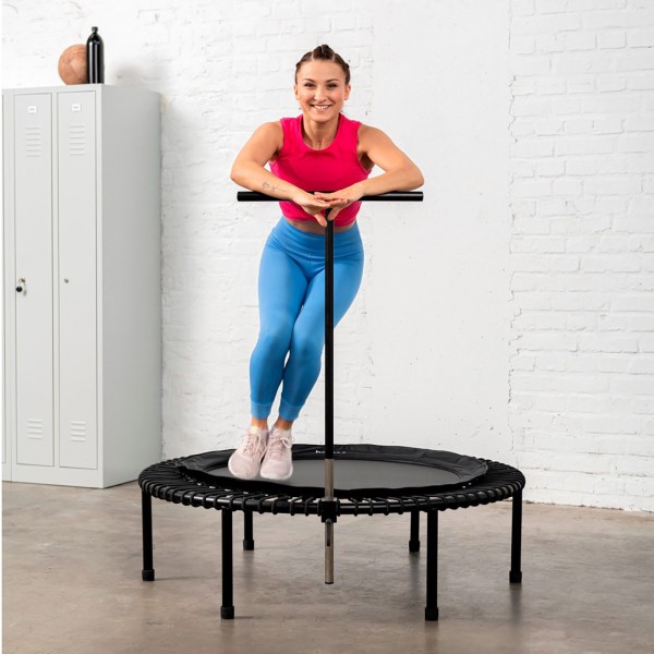 Person using the bellicon T Bar Handle on a trampoline.