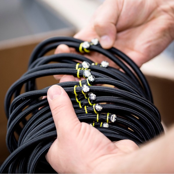 Close-up of bungees on Bellicon Classic Black Trampoline.
