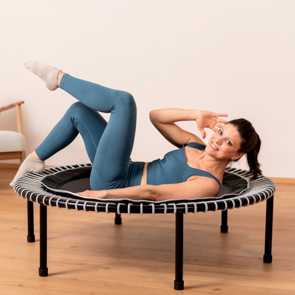 Person exercising on Bellicon Classic Black Trampoline.