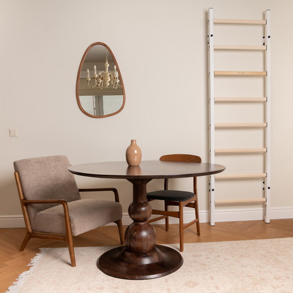 White BenchK 200 Wall Bars in a dining space with round table and chairs