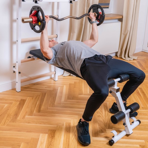 BenchK 733 Series 7: 700 Wall Bars (White) + Steel Pull Up/Barbell Holder + Dip Bar + Bench - mid-workout view
