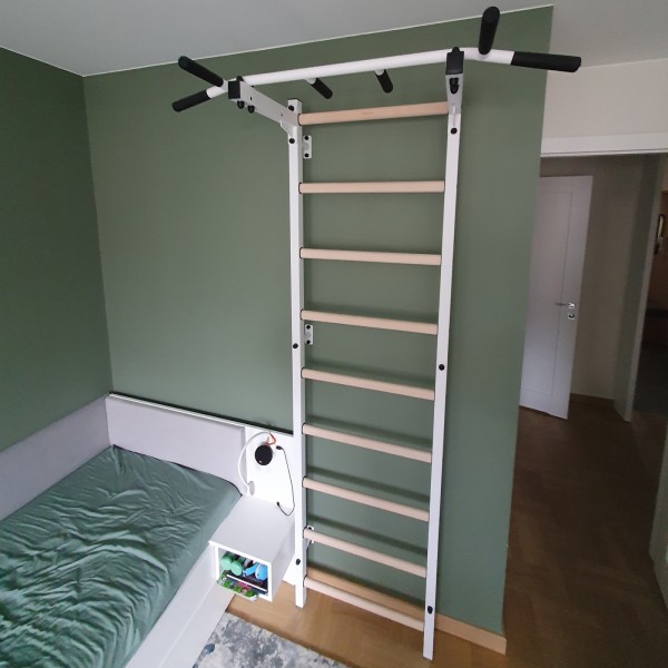 BenchK Pull Up Bar PB2W White - assembled on a ladder in a bedroom