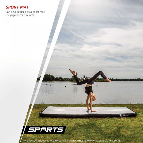 Athlete practising a handstand on the BERG AirTrack Home near a lake.