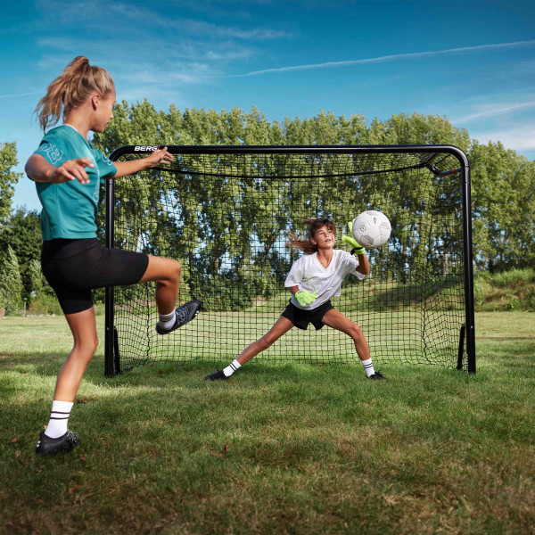 One player shooting while another saves the ball at the BERG SportsGoal.
