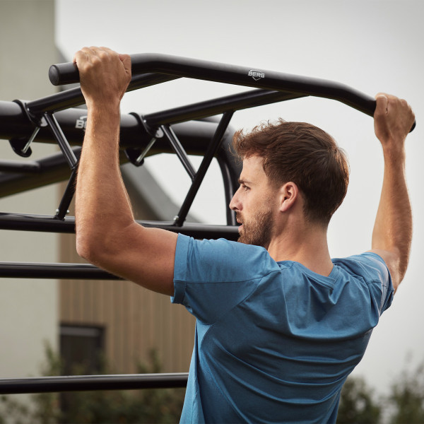 Close-up of user gripping the BERG PlayBase Pull-Up Bar