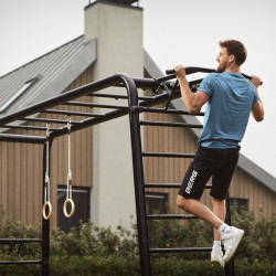User performing pull-up on the BERG PlayBase Pull-Up Bar
