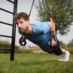 Person performing suspended push-up on BERG PlayBase