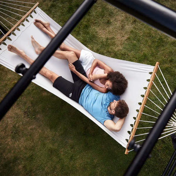Two people relaxing in the BERG PlayBase Hammock
