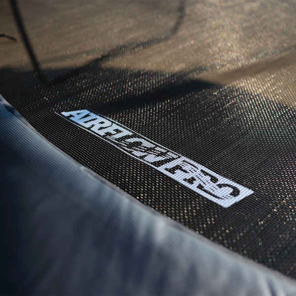 Close-up of the jumping mat with logo on the BERG Champion Regular Trampoline with Safety Net Deluxe