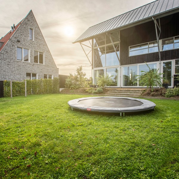 BERG Sports Favorit InGround Trampoline assembled in a back garden.