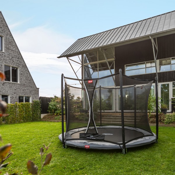 BERG Favorit InGround 330 Trampoline With Safety Net Comfort assembled in a back garden.