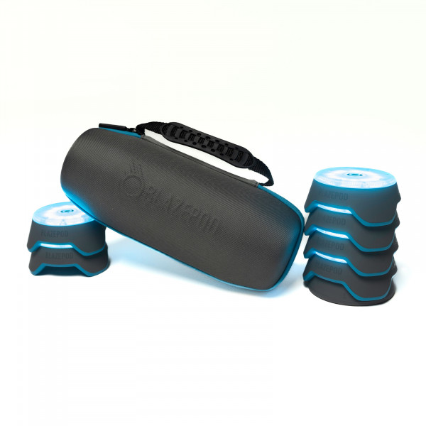 BlazePod kit with four pods stacked on charger and two to the side
