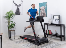 Male model using a bodymax t60 treadmill in a home