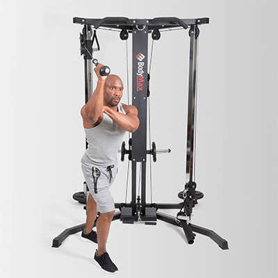 Model performing overhead cable extension on the BodyMax Cable Motion Rack System