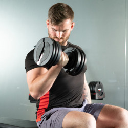 User performing curl with the BodyMax 25 kg Selectabell Adjustable Dumbbell