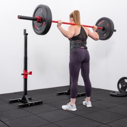 User performing a barbell squat with the BodyMax CF310 Home Squat Stands