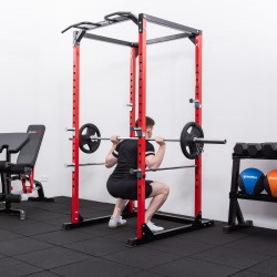 User squatting with a loaded barbell inside the BodyMax CF375 Power Rack
