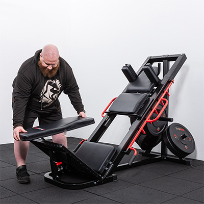 Model adjusting pads on the BodyMax CF800 Leg Press / Hack Squat Machine