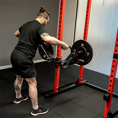 Model performing a lat raise with the BodyMax Rack Fly Attachment