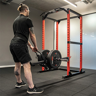 Image of a model using the BodyMax Belt Squat Attachment.