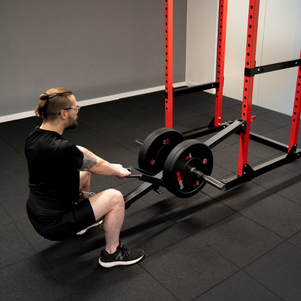 Lifestyle image of a model using the BodyMax Rack Belt Squat in a full squat.