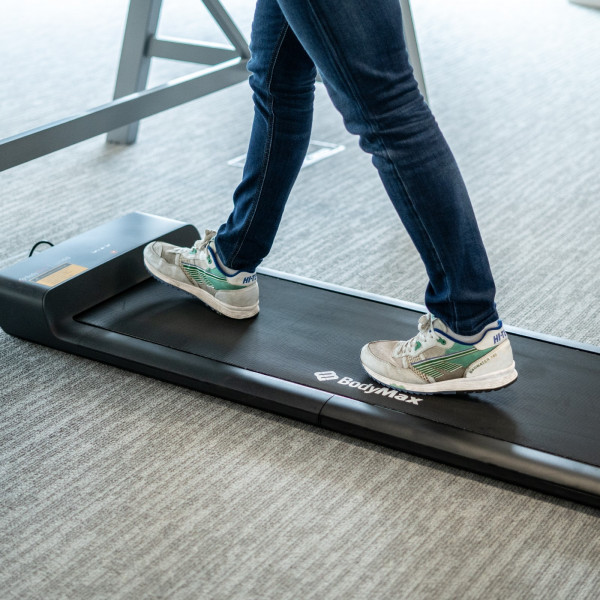 Close-up of a user walking on the BodyMax WP60 Treadmill Walking Pad