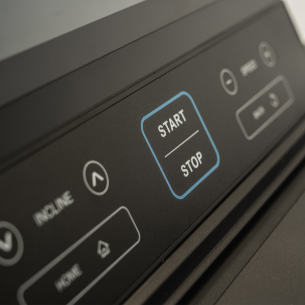 Start and stop buttons on the BodyMax TM70 treadmill console
