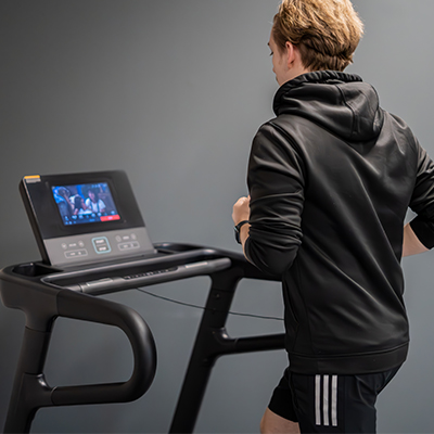 Rear view of user running on the BodyMax TM70 treadmill