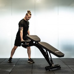 The BodyMax UB5 Bench is a sturdy weight bench for home gym lifted by a model