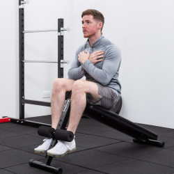 Image of a model using the BodyMax CF306 Adjustable Abdominal Board / Sit Up Weight Bench for sit-ups