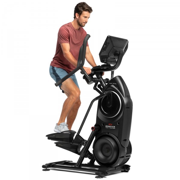 An exerciser customising their workout routine on the BowFlex Max Total 40, highlighting the machine's versatility