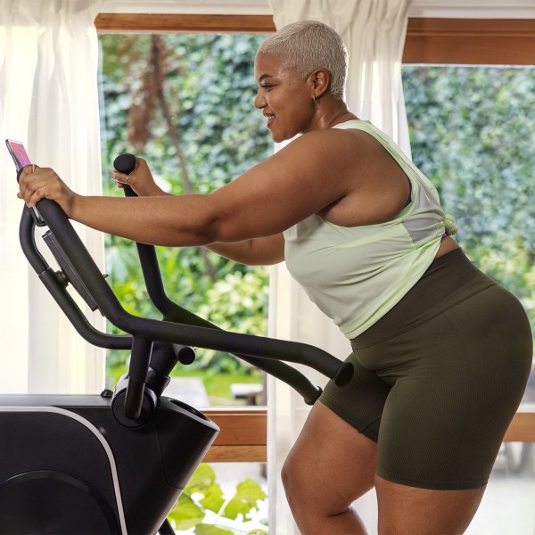 User actively engaged in a workout on the BowFlex Max Trainer SEi