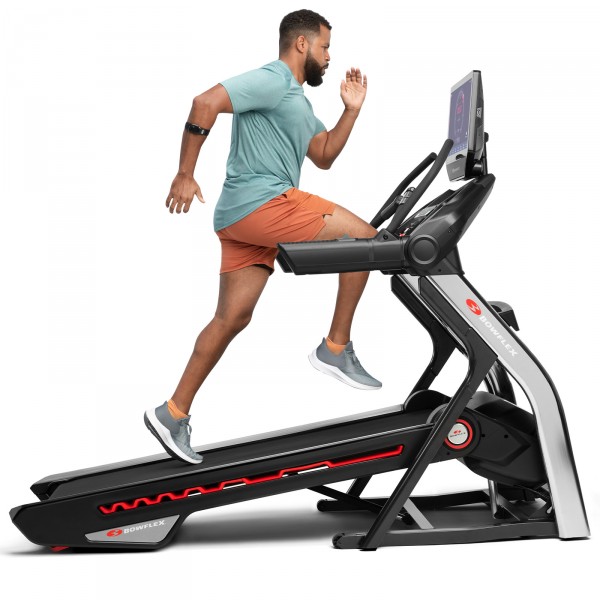 A user running on the BowFlex BXT56 Treadmill with the surface inclined