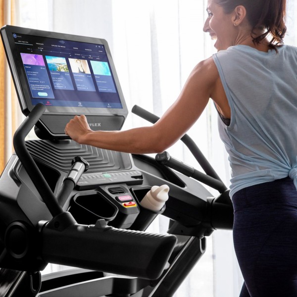 Exerciser starting workout on the BowFlex BXT56 Treadmill