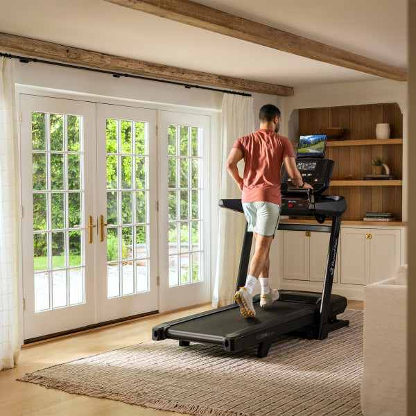 Person running on the BowFlex T9 treadmill.
