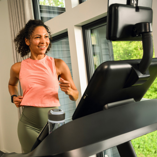 Person running on the BowFlex T6 treadmill viewed from the front
