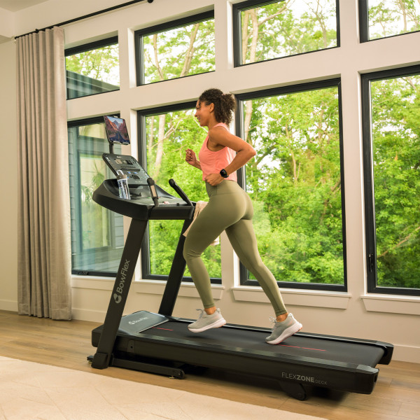 Person running on the BowFlex T6 treadmill at home