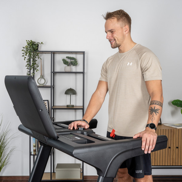 Person standing at the cardiostrong TX30 Treadmill before a workout