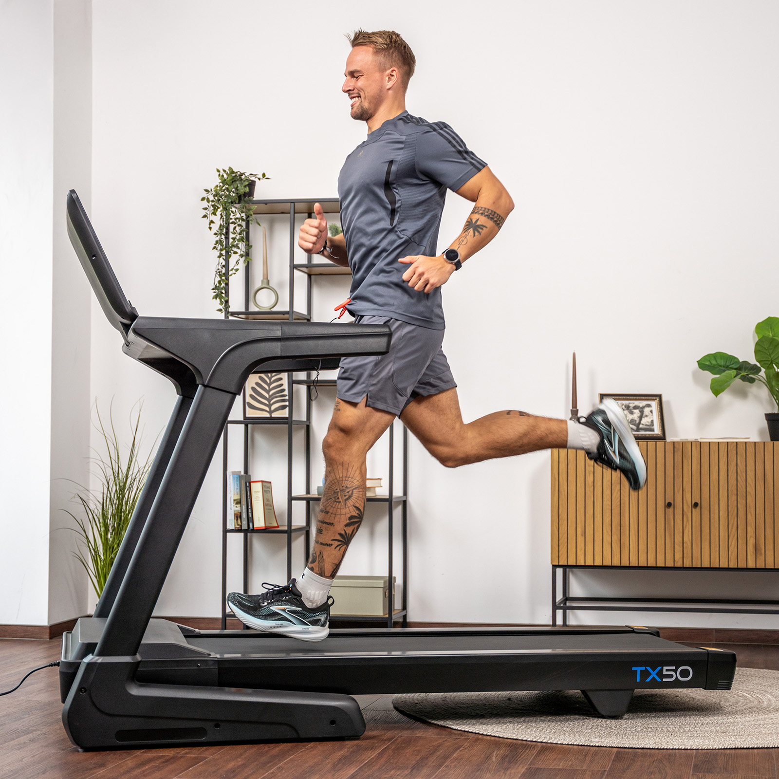 User running on the cardiostrong TX50 Treadmill. 
