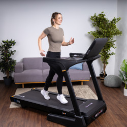 A person running on the cardiostrong TX70 Treadmill.