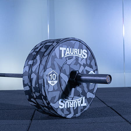 Taurus Camo Plates loaded onto a Taurus Barbell.