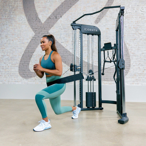 Person using the multi-purpose belt on the Centr 2 Home Gym Functional Trainer.
