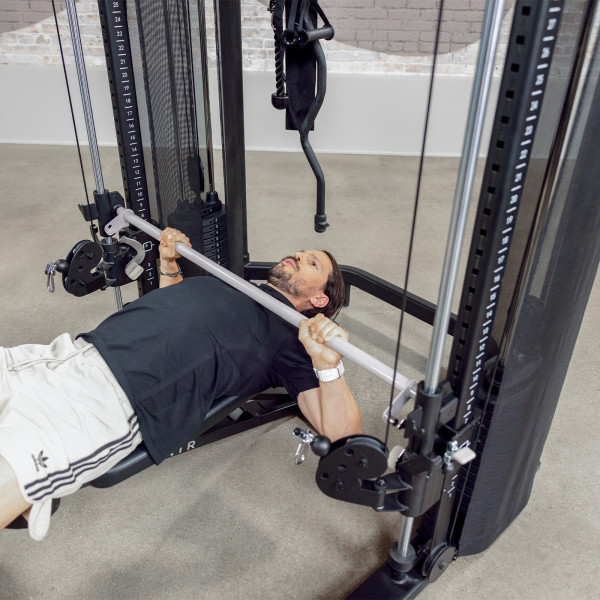 Person performing bench press on Centr 3 Home Gym Functional Trainer with Selectorised Smith Bar.