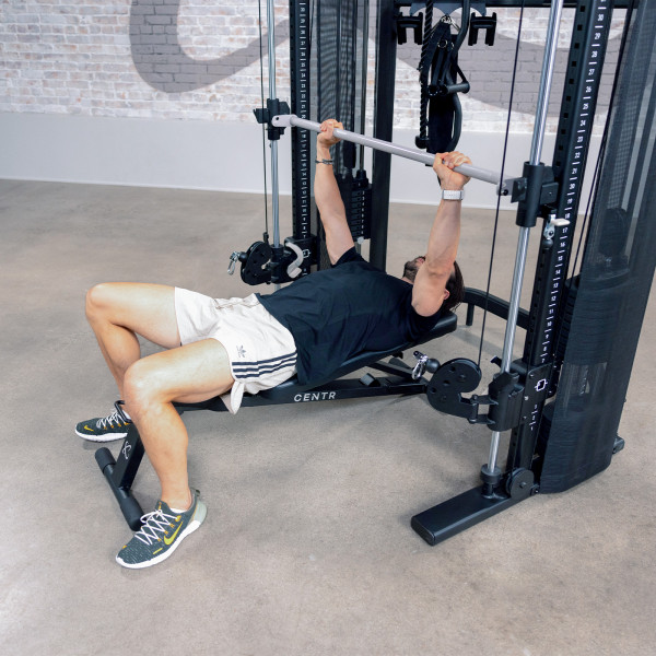 Side view of person bench pressing on Centr 3 Home Gym Functional Trainer with Selectorised Smith Bar.